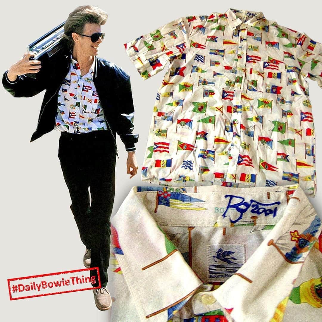 デヴィッド・ボウイさんのインスタグラム写真 - (デヴィッド・ボウイInstagram)「DAILY BOWIE THING – Day 14   “Uncage the colours, Unfurl the flags...” *   Across the years David Bowie made available a few items from his wardrobe which he no longer wanted. In most cases the pieces of clothing would be autographed and donated to charity, or auctioned with the proceeds going to charity.   Back at the start of the century a fair number of shirts, trousers, jackets and other interesting things were auctioned via BowieNet on eBay.   Often the pieces would be recognisable as clothing David had worn for photo shoots or publicly, such as today's example. Listed as an "ensign shirt", there are several pictures of Bowie wearing it in 1987, generally photographed by our old friend, Denis O’Regan, as was today’s picture.   Were you lucky enough to have purchased one of these lots back then? Do you still have it?   Items still turn up occasionally when the original purchaser is having to let go for one reason or another. But, as you might imagine, you’re unlikely to pick anything up nowadays for anything like they were going for back then.   Come back tomorrow when we’ll be focusing on more sheet music for the #DailyBowieThing.   * Eagle-eyed readers will notice we pluralised flag to fit with the story.   #DailyBowieThing  #BowieClothing」11月14日 22時09分 - davidbowie