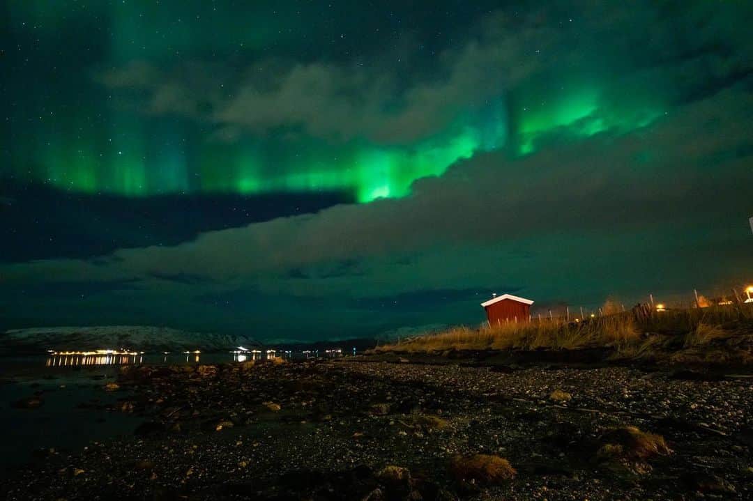 thephotosocietyさんのインスタグラム写真 - (thephotosocietyInstagram)「Photo by Pete McBride @pedromcbride / I am excited to work on my next @rizzolibooks project on natural sounds and the magical realm of silence. The quiet dance of the Arctic lights was a spellbinding finish to a cold day training in the icy ocean.   The northern lights, formally known as aurora borealis, emerge in the sky when the sun's outermost plasma drives the solar wind towards Earth. The particles collide with nitrogen and oxygen atoms in the atmosphere and create ions that give off the colors we see lighting up the sky. This natural phenomenon has fascinated people for centuries, and it is even thought to be depicted in a cave painting dating back to 30,000 B.C.  For those interested, my last @rizzolibooks on the Grand Canyon, which won Banff & Outdoor Book awards, is available on Amazon and where photo books are available. For more quiet places, follow @pedromcbride. #nature #northernlights #Norway #humbled by #silence #quiet 📷 by #PeteMcBride」11月16日 0時50分 - thephotosociety