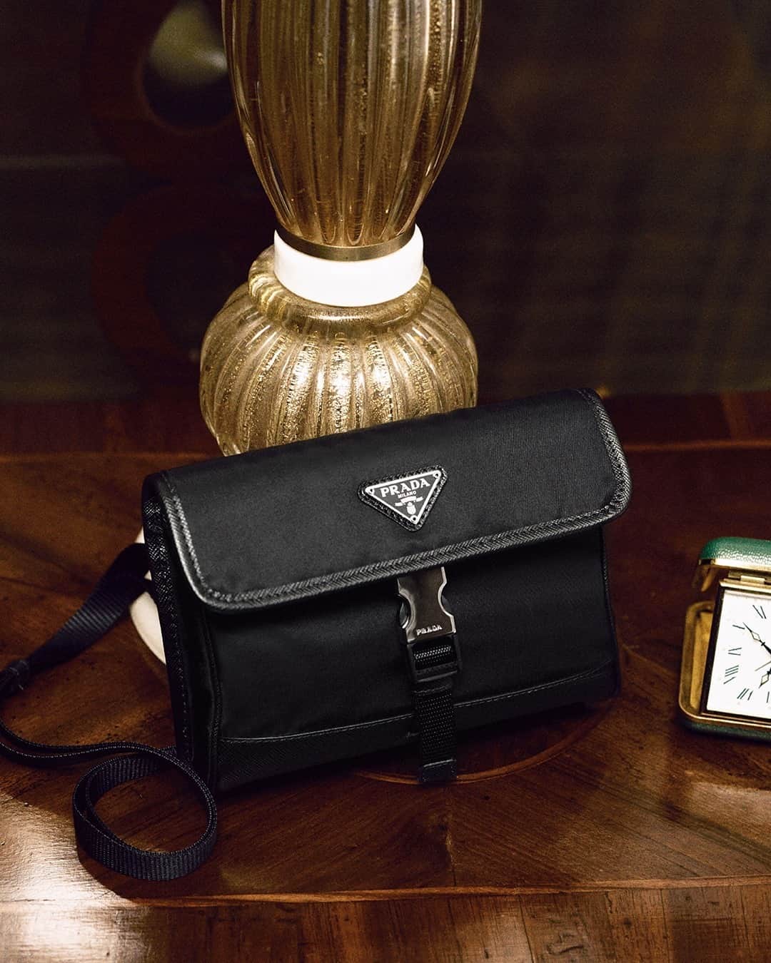 のインスタグラム：「In the story things start disappearing. Does the #PradaReNylon smartphone case contain any of them in “A Stranger Calls”? - #PradaHoliday20 mystery unfolding now.  Discover more via link in bio. Creative direction @ferdinandoverderi #PradaGifts #Prada」