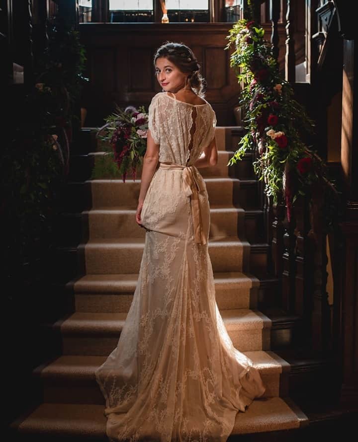 ミナのインスタグラム：「Looking for a non white wedding dress? Our vintage-inspired Kay dress has a blush coloured silk under slip that's cut on bias and super comfortable to wear. The dress is made of two different laces and has a gorgeous back. ⁠ ⁠ Venue - @baddowparkhouse ⁠ Photographer - @flowtography_uk⁠ Model - Evangelina⁠ ⁠」