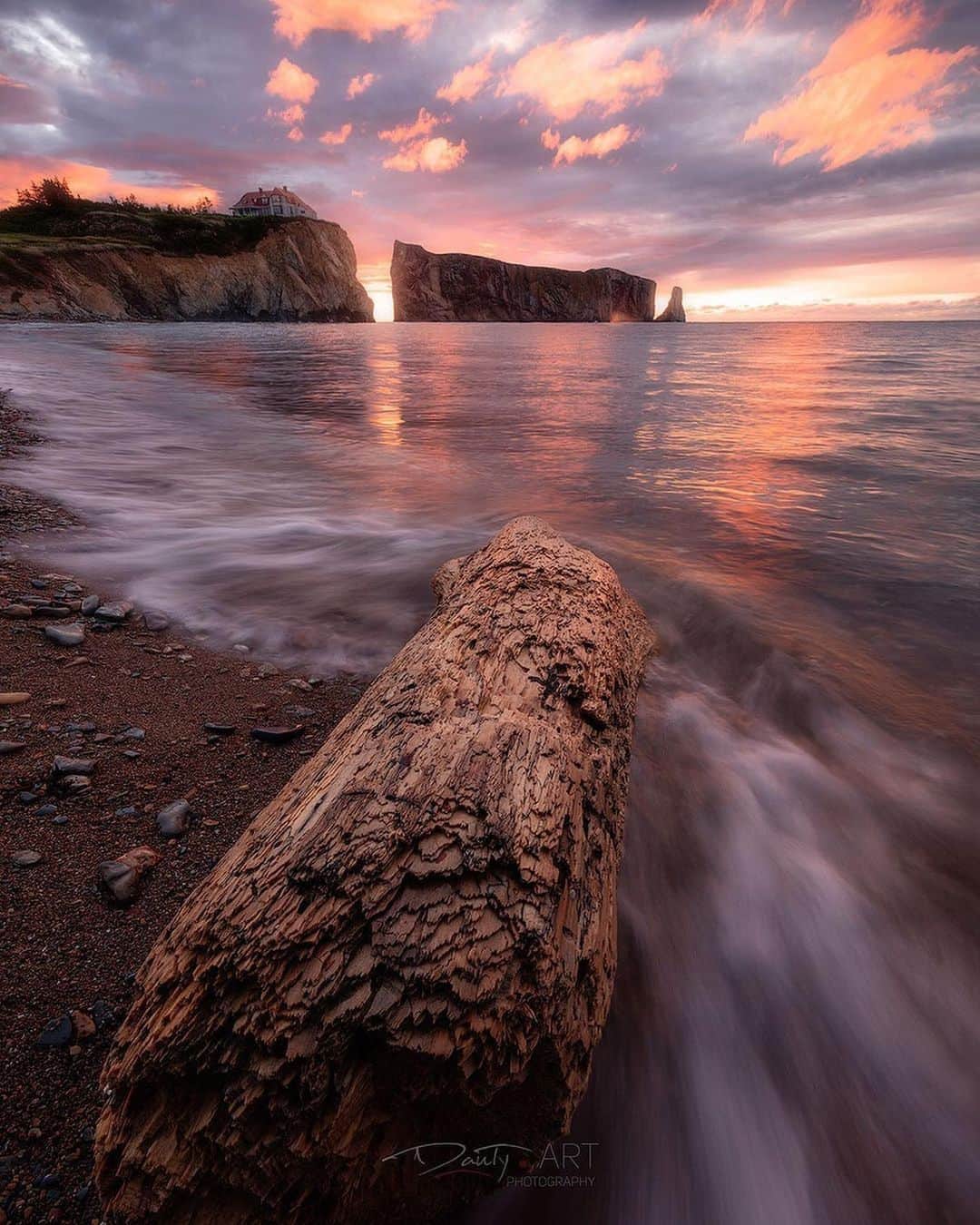instagoodさんのインスタグラム写真 - (instagoodInstagram)「@dantyartphotography Fire Breathing; As one of the most iconic scene of the Province of Quebec, Rocher Percé which stands for Pierced Rock, truly is breathtaking! Even if I live kind of close to it....if we consider driving 10 hours a short distance, I have only been there once almost 15 years ago. I was truly happy to go back there last week as it brings back some good memories of Gaspésie Peninsula! The landscapes there are so different then what we have in Montreal. What a lovely part of my province this is! That morning was my last one of this very short and spontaneous trip before driving back those one thousand kilometers back home. And due to the fact that the trip was planned very last minute, I didn’t get to choose according to the tides...the ideal tide would have been much lower allowing me to go closer to Rocher Percé so instead of that, I found a huge chunk of log on the beach, used it as a cool foreground interest and went for this composition which shows the rock formation right next to the main land. Let’s go back in time a little...Jacques Cartier who was the first french explorer to navigate to the newly discovered continent and all along the Gaspésie coast at the beginning of the 16th, noticed a rock formation. That rock formation had three holes in it back then. The second hole collapsed in 1845 leaving the smaller sea stack on the right of Rocher Percé. And today, only one arch still remains. Many tons of rocks are falling from Rocher Percé every year which makes it really unsafe to be anywhere around the rock. And according to some experts, the last arch should collapse in approximately 400 years so you have plenty of time to see it!  This image was shot with my Canon 5DSr and a Canon EF 11-24mm f4.0 at 14mm, 0.5 second, f11 and ISO 125. I did use a @fotodioxpro 2 stop Neutral Density filter to slow down the motion of water a little! Is visiting this lovely area part of your plans for anytime soon? You would for sure love Gaspésie! 😊」11月17日 22時39分 - instagood