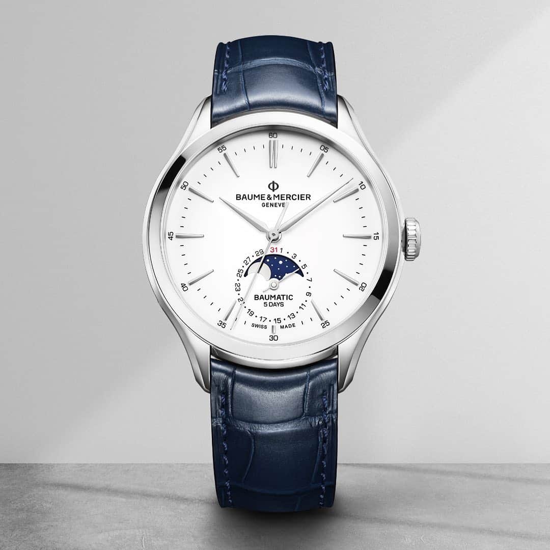 ボーンメルシーのインスタグラム：「Experience the Essence of Time.  -- Clifton Baumatic 10549 Automatic Date Moon Phase, 42mm, 5 ATM Water Resistant, Blue Alligator Strap --⁣ #baumeetmercier  #baumatic  #Watches  #Watchdesigner  #Swissmade  #Watchmaking  #innovation  #design  #materials  #leather  #luxury4you」