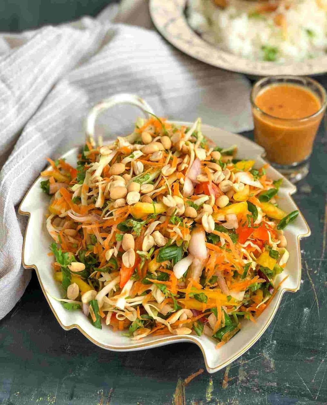 Archana's Kitchenさんのインスタグラム写真 - (Archana's KitchenInstagram)「Give this absolutely crunchy Asian Cabbage Salad tossed with peanut butter and fresh ginger along sweet and spicy sauces a try. It makes a wholesome meal on its own and perfect for dinners. Get the recipe from the smart.bio link in my profile @archanaskitchen. . . . . . #recipes #salad #saladrecipes #peanutsalad #homemadefood #eatfit #cooking #food #healthyrecipes #foodphotography #recipeoftheday #comfortfood #deliciousfood #delicious #instayum #food」11月18日 14時30分 - archanaskitchen