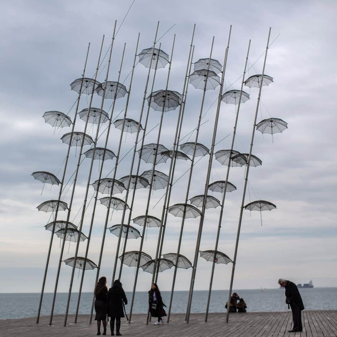 National Geographic Travelさんのインスタグラム写真 - (National Geographic TravelInstagram)「Photo by Muhammed Muheisen @mmuheisen / A woman poses for a picture by the "Umbrellas" sculpture on the seafront of the Greek city of Thessaloniki. The work was created by artist George Zongolopoulos. For more photos and videos from different parts of the world, follow me @mmuheisen and @mmuheisenpublic. #muhammedmuheisen #Thessaloniki #Greece」11月19日 0時38分 - natgeotravel