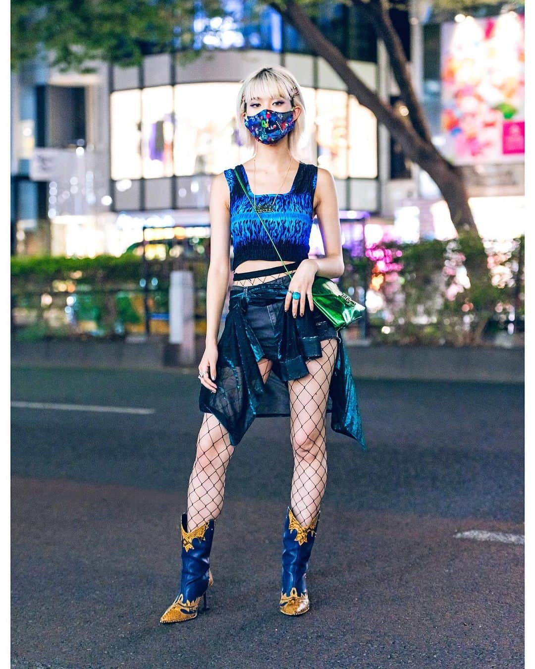 Harajuku Japanさんのインスタグラム写真 - (Harajuku JapanInstagram)「English-speaking Japanese street style personality Rikarin (@rikarin0526) on the street in Harajuku wearing a graphic crop top from Bluesis Tokyo with denim shorts, a scarf tied to look like a skirt, a metallic Bluesis bag, Yello Japan snakeskin cowboy boots, and a Tender Person necklace. Swipe left to see her cowboy boots.」11月20日 4時10分 - tokyofashion