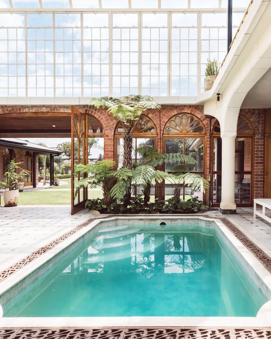 Airbnbのインスタグラム：「Want to be first in line to welcome the new year? You have to go east! Really, really far east. Like to Christchurch, New Zealand where you can find one of our most architecturally beautiful listings, Britten Stables. Toast to a new era in a turquoise pool, in a peaceful atrium under the stars. Here’s to making this a way better year (which honestly won’t be that hard!).🥂 Link in bio.」