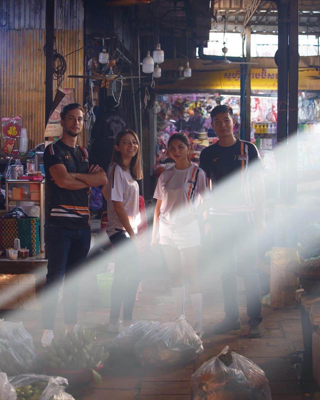 Shunsuke Miyatakeのインスタグラム：「Concept visual of @angkor_tiger  new jersey for 2021   Model / @unofficialmcberger  @mila.dance.wm  @saysopheakneath__   Place / BKK Market, Phnom Penh  Special thanks / @taka_kiyone   Angkor Tiger FC, as a football club loved by Cambodian supporters, and as a football club that exists in people's daily life, I'm honored to be able to create their new concept visual not in a studio or in some privileged place but in the middle of Everyday Life in Cambodia.」