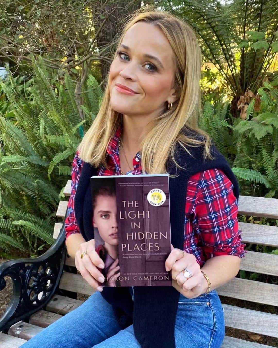 リース・ウィザースプーンのインスタグラム：「Talk about a story that inspires! This month, our @reesebookclub YA pick is the extraordinary true story of Stefania Podgorska, a Polish teenager who risked her life by hiding thirteen Jewish neighbors in her attic during WWII. ✨ This historical page-turning novel,  #TheLightinHiddenPlaces by @sharoncameronbooks filled me with such deep admiration for this young heroine and her remarkable selfless acts of humanity. A great historical book for any age reader! I hope you enjoy our December YA pick and follow along at @reesesbookclub! 📚」