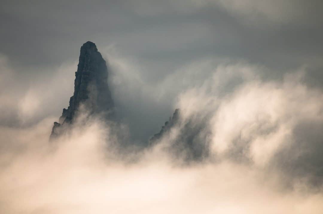 National Geographic Travelさんのインスタグラム写真 - (National Geographic TravelInstagram)「Photo by @steven_gnam / Clouds flow around spires in the Rocky Mountains of Montana. #Montana #mountains」12月15日 20時38分 - natgeotravel