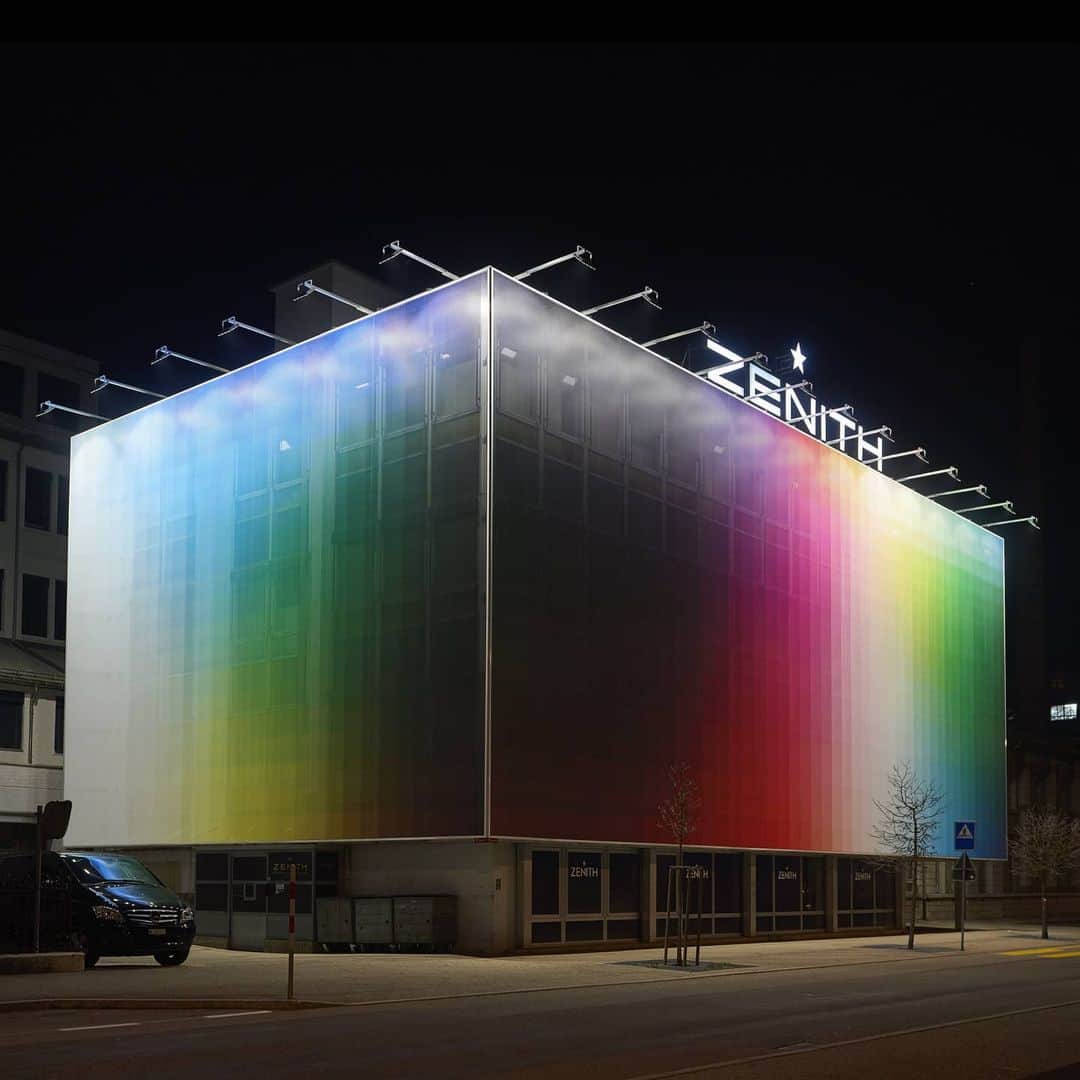 ゼニスのインスタグラム：「#FelipePantone: With @FelipePantone, ZENITH has become the first Swiss watch manufacture to offer its premises as a canvas to a contemporary artist.  An original conception for the Zenith Manufacture's main building in the UNESCO World Heritage Site of Le Locle, Felipe Pantone imagined a grand piece covering the entire building’s façade in his signature style, combining a striking spectrum of colours with a “pixelized” aesthetic.    #Zenith #ZenithWatches #FelipePantone #ZenithxFelipePantone #Collab #StreetArt #ContemporaryArt #TimeToReachYourStar #Artist #StreetArtist #Art #ContemporaryArtist #UNESCO #Manufacture」