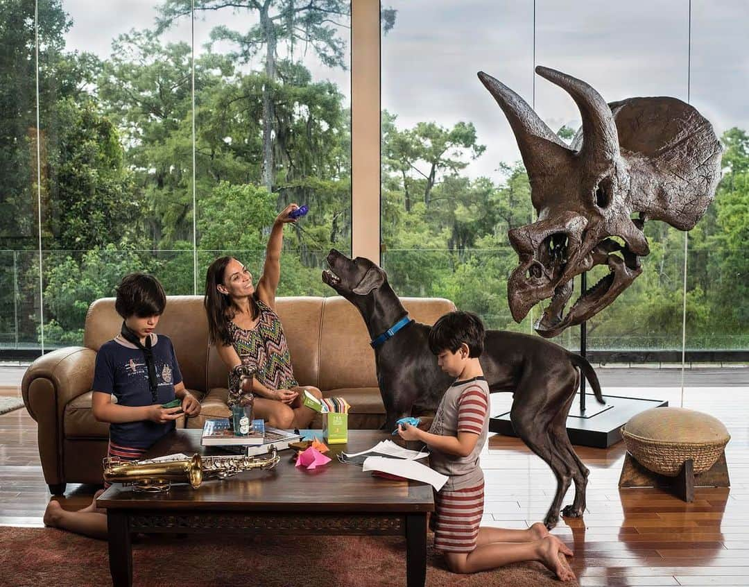 thephotosocietyさんのインスタグラム写真 - (thephotosocietyInstagram)「Photo by @gabrielegalimbertiphoto and @jurideluca  Fossils of long-extinct creatures aren’t just for museums. Today they're in homes and businesses, as wealthy collectors indulge a controversial hobby. In Mandeville, Louisiana, Ana Maria Perdigao and her children Nicolas (11) and Isaac (8) are seen in their living room, which has a fantastic view of one of the state's quintessential swamps. Joseph Perdigao, the husband of Ana Maria, who is not in this photo said "I bought this skull three weeks ago. It’s actually a birthday present that I gave to myself. I wanted to buy something beautiful to keep in our living room. I was looking on internet for something connected to natural history, one of my big passions, and I found the website of a company specialized in finding, restoring, and selling dinosaurs fossils. I didn't know until that moment that I could buy a real fossil of dinosaur or a cast of it. I immediately understood that that was exactly what I wanted for my house. So, I bought this cast of triceratops. I didn't say anything to my family until the dinosaur got here. They were positively shocked to see it when they came back home.” #dinosaur #dino #triceratops」12月16日 0時14分 - thephotosociety