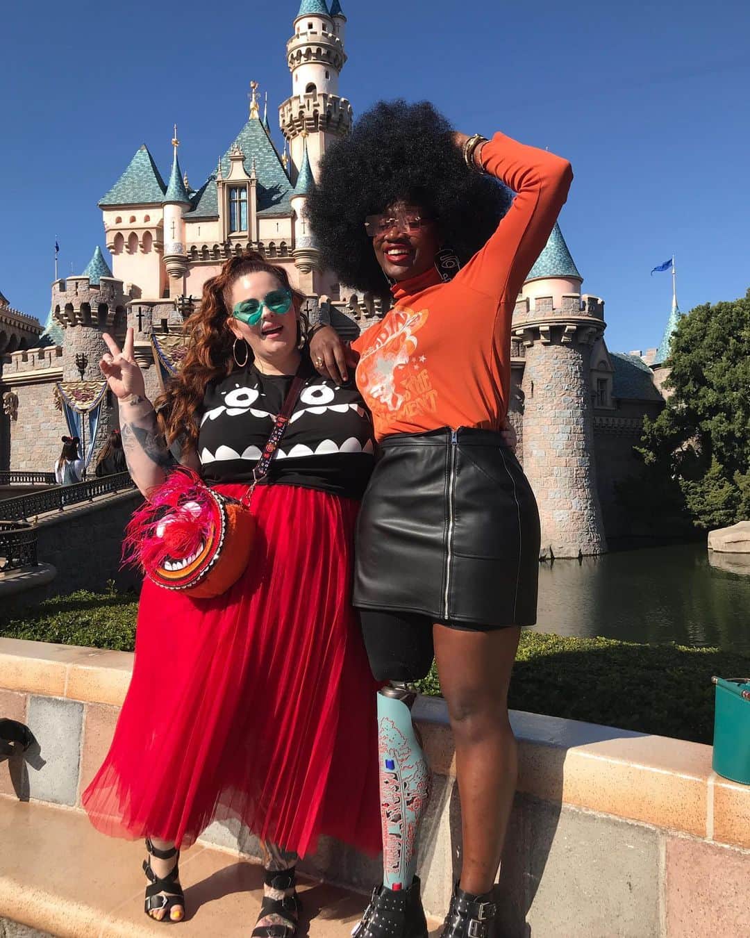 テス・ホリデーのインスタグラム：「A year ago today I was laying in bed & my friend Holly text me and said “I’m so sorry about your friend Cax” & I laughed & replied “what are you talking about??” thinking she was mistaken about something. Laughing is sometimes my first reaction to difficult news, & little did I know it would be quite a while before I laughed again. Then, I started saying out loud “please God, please God please god” as I furiously typed Cax’s name into IG. Her page pulled up, and I screamed. I don’t know how long I screamed, I don’t know how long I cried, but I knew I had never felt a loss like that. I had just FT with @mamacax to tell her about my divorce, she had gushed about her partner & how happy she was, we just laughed together, she had just scolded me for not eating enough food & looking after myself. I didn’t understand.   I spent that day scrolling through IG pages that shared memories of her, anything to feel close to her, and I discovered @trevor_stuurman & we unexpectedly forged a friendship  because of our love for her.  That’s how powerful she was, & still is. If it wasn’t for her, I wouldn’t have met @findingpaola who I’m honored to call my friend as well.   To have been loved by Cacsmy was an extreme honor & I’m so grateful for the time we shared on earth. This photo of her always brings a smile to my face because it was her first time at Disneyland & I remember little girls asking if she was a princess all day, & her laughing with them.  She looked so beautiful. I also remember & her firmly telling the Disney employee on the Peter Pan ride that was trying to kick us off 🙃 that her leg wouldn’t bend anymore to fit into the ride & that they needed to watch how they spoke to her & make their rides more accommodating. Guess who still got to ride Peter Pan too? Yup. We did. 💅🏿💅🏻  I’ll love you forever Cax & I’ll never settle for less than what I deserve because of you. #mamacaxforever」