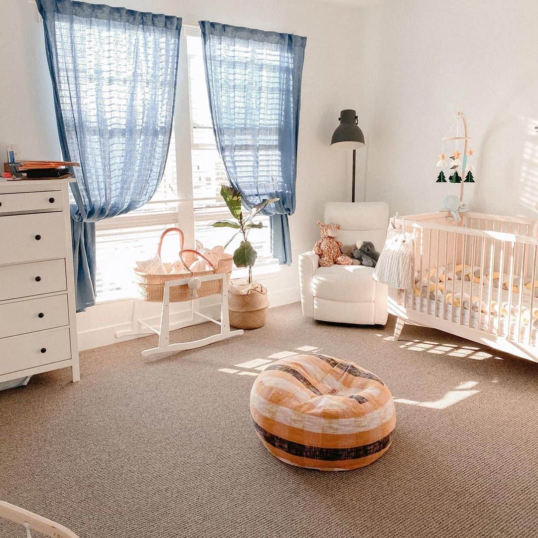 Bianca Cheah Chalmersのインスタグラム：「OK, so I finally got around to sharing Oliver's nursery design. 2020 has meant that we're spending a lot more time at home, which is why I wanted to focus on a clean, minimalist design that maximizes playing space in the centre of his room. I opted for soothing blue sheers and plantation shutters with predominantly neutral timber furniture to encourage a light and airy feeling. The newest addition and Christmas present to Oliver's sanctuary will be a Montessori climbing gym- maybe this will stop him climbing all over the dining table... 🤣」