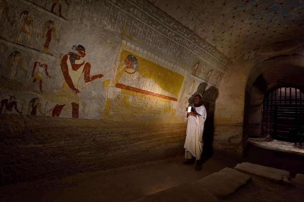 National Geographic Travelさんのインスタグラム写真 - (National Geographic TravelInstagram)「Photos by Robbie Shone @shonephoto / Uncle Ali illuminates an archway in the tomb of the Nubian King Tantamani (Tawentamani). Located in El Kurru, Sudan, the tomb was originally excavated in rock under the pyramids that are now partially collapsed. It is completely decorated with multicolor hieroglyphic inscriptions and amazing images of the pharaoh and the gods.」12月17日 6時55分 - natgeotravel