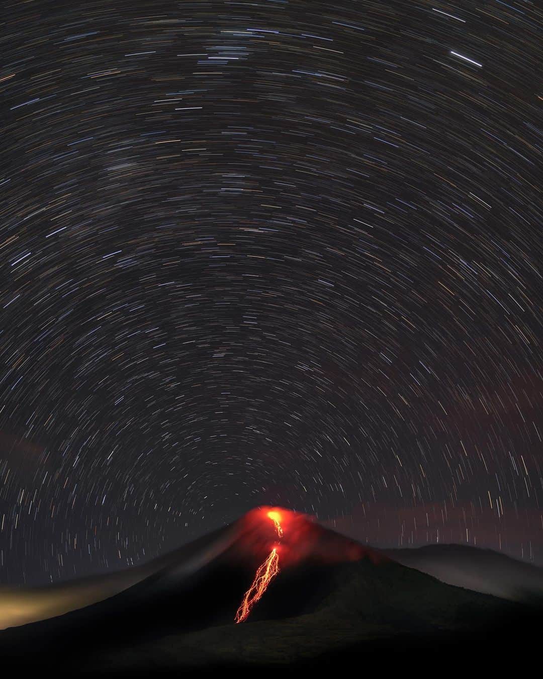 National Geographic Travelさんのインスタグラム写真 - (National Geographic TravelInstagram)「Photos by @babaktafreshi / In this long-exposure image from Guatemala, star trails formed due to the Earth's rotation in the sky above Pacaya, one of the world’s most active volcanoes. Swipe for a closer view where the North Star, Polaris, appeared right on the shoulder of the volcano from this tropical latitude 14 degrees above the Equator. Explore from Earth to the universe with me @babaktafreshi. #twanight #volcano #guatemala #earth #longexposure」12月17日 0時52分 - natgeotravel