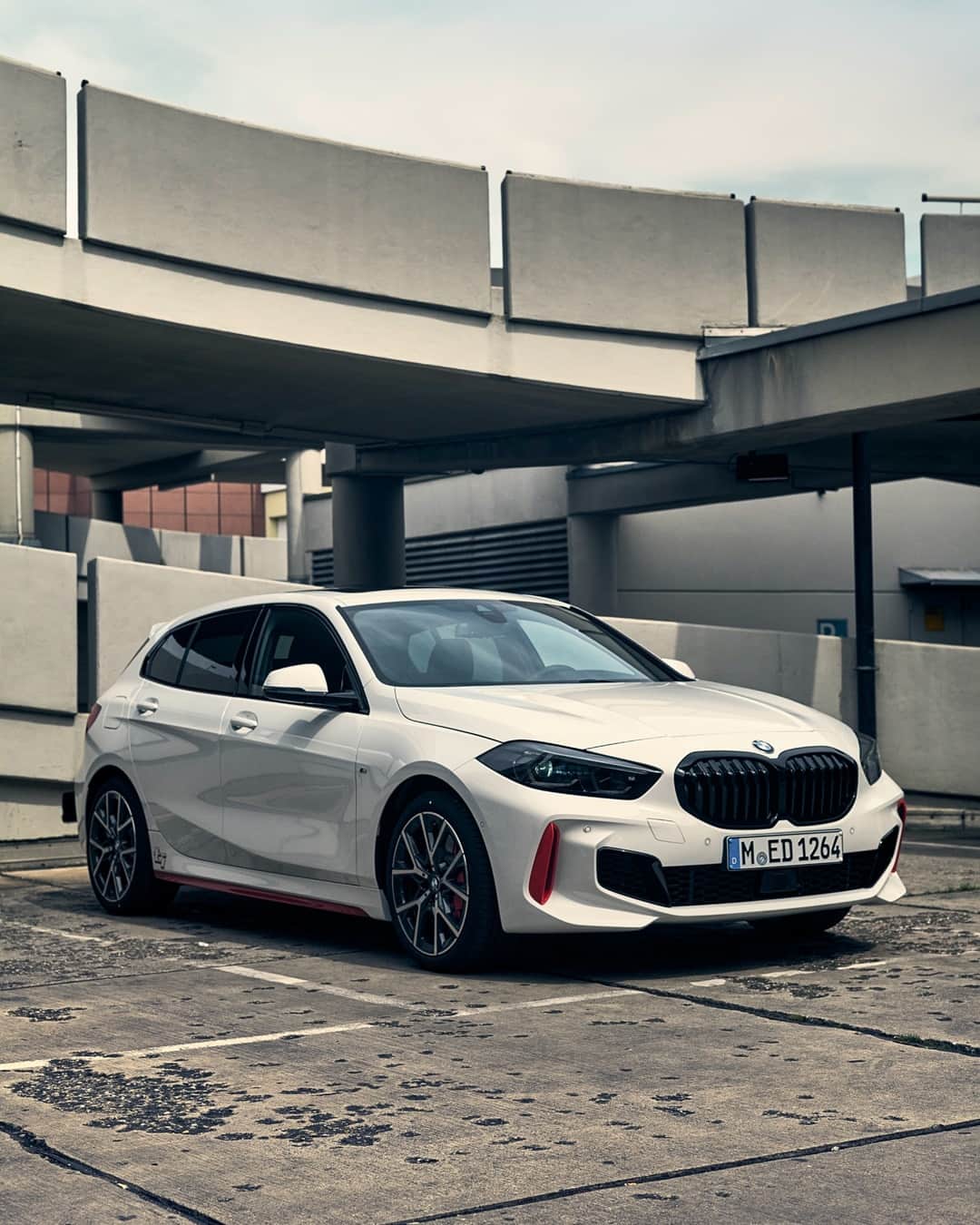 BMWのインスタグラム：「Just lets you be yourself. The new BMW 128ti. #THE1 #BMW #1Series #sports  __ BMW 128ti: Fuel consumption in l/100 km (combined): 6.4–6.1. CO2 emissions in g/km (combined): 148–139. Further information: www.bmw.com/disclaimer.  Acceleration (0-100 km/h): 6.1 s. Power: 195 kW, 265 hp, 400 Nm. Top speed (limited): 250 km/h.」