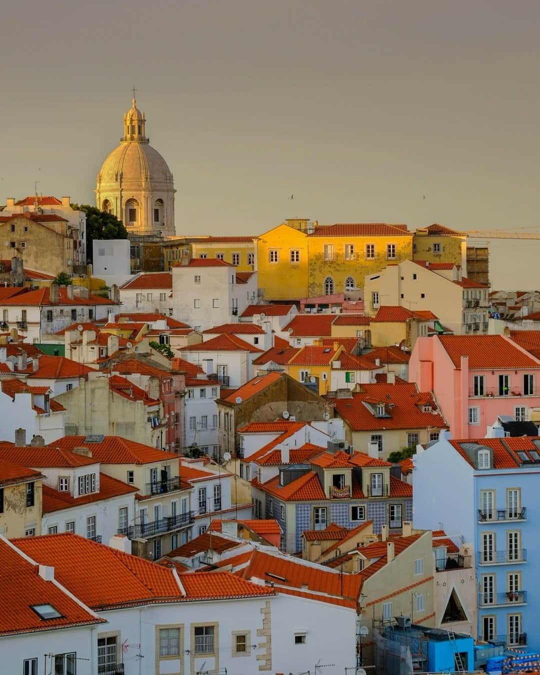 National Geographic Travelさんのインスタグラム写真 - (National Geographic TravelInstagram)「Photo by @francescolastrucci / A view over the colorful houses and roofs in Lisbon's Alfama neighborhood, dominated by the dome of the National Pantheon. Alfama is a fascinating maze of cobbled streets and ancient buildings that stretches over steep hills from the River Tagus estuary to the São Jorge Castle.  Historically, Alfama has had many ups and downs, but it has always represented the soul of the city.  Follow me @francescolastrucci for more places, daily life, and stories around the world. #lisbon #portugal #landscapephotography」12月17日 8時35分 - natgeotravel