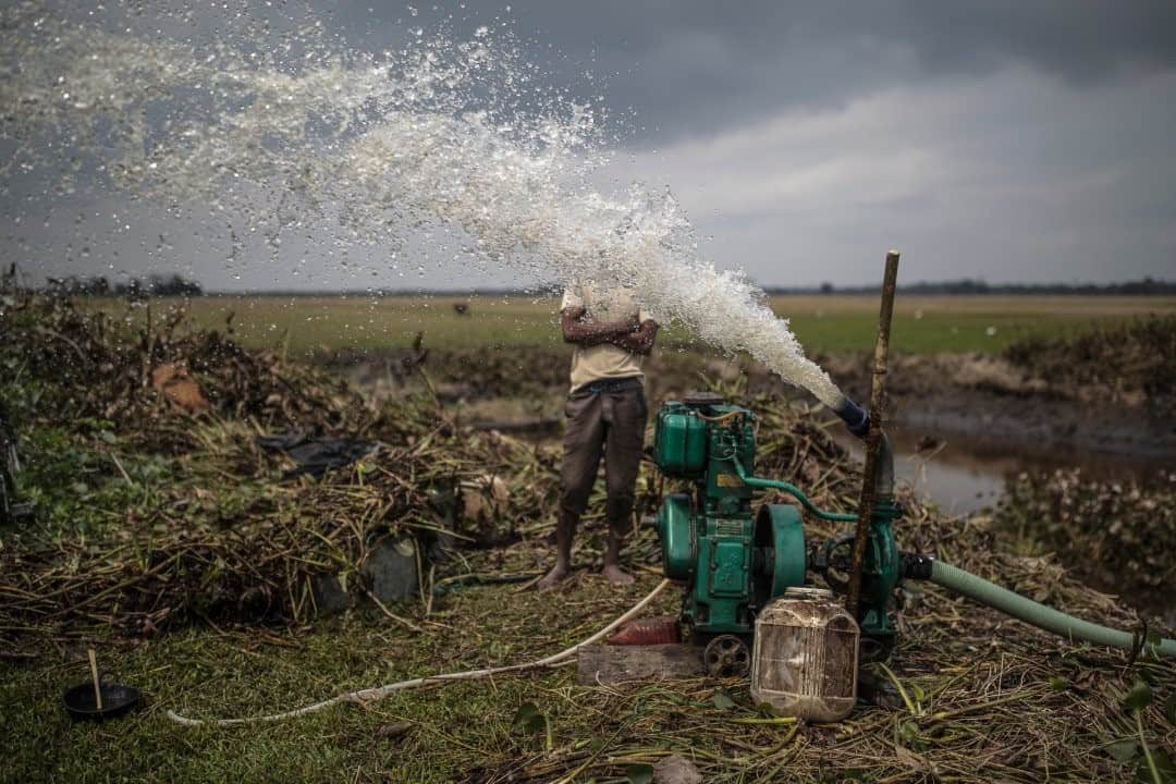 ナショナルジオグラフィックさんのインスタグラム写真 - (ナショナルジオグラフィックInstagram)「Photo by @johnstanmeyer / Rajib Kutum, 35, in Upar Chumaimari village on Majuli Island in Assam, India, pumps all the water out of his fishpond to collect the fish he’s been farming. An agricultural farmer and a fish farmer, Rajib loses his fish farm when the monsoon season arrives and all the land is covered by the waters of the Brahmaputra River. Majuli is the world’s largest river island. The image is from my latest story in the August issue of @natgeo magazine, "Water Everywhere, and Nowhere," now on newsstands worldwide. @outofedenwalk #walkingindia #edenwalk #india #majuli #assam  Check out Nat Geo's link in bio for more on this story.」12月18日 10時33分 - natgeo