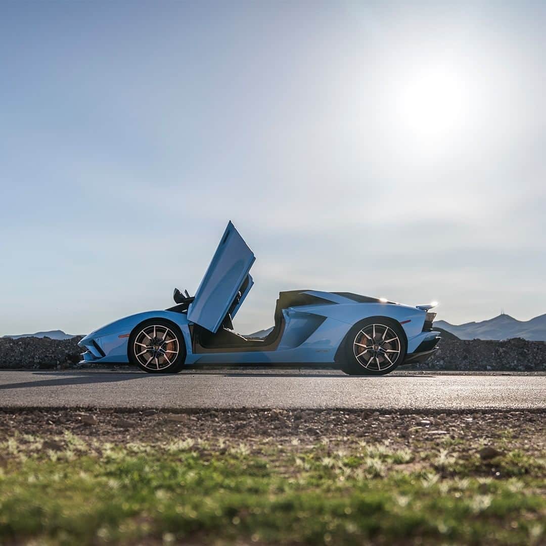 ランボルギーニのインスタグラム：「Aventador S Roadster makes you question your traditional idea of speed.  Can you guess its color? Blue Cepheus or Blue Aegir?  #Lamborghini #AventadorSRoadster #GuessTheColor」