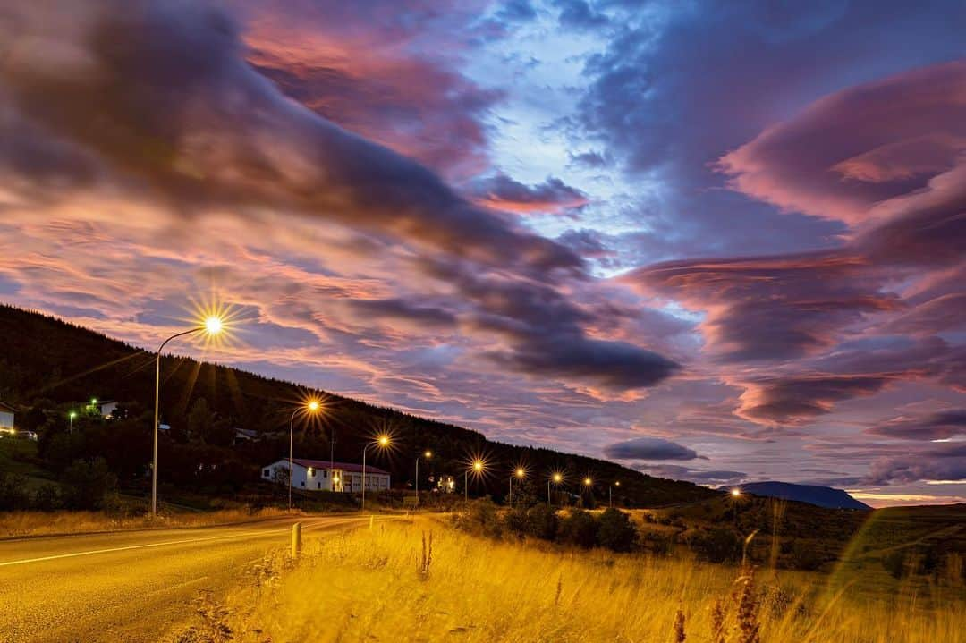 National Geographic Travelさんのインスタグラム写真 - (National Geographic TravelInstagram)「Photos by @babaktafreshi / I was on Ring Road in a northern town in the less visited part of Iceland. Moments after sunset the overcast sky began to open. An impressive display of lenticular clouds were still reaching sunlight at their high altitude. Swipe for a closer view of the multilayer clouds resembling a stack of pancakes! Lenticulars reflect light much more than usual clouds, making them appear bright.  Explore more Earth and sky photography with me @babaktafreshi. #sunset #nature #iceland」12月19日 0時40分 - natgeotravel