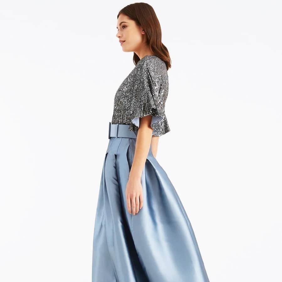 サッチン+バビのインスタグラム：「The Simone gown is a vision in powder blue and pewter. A classic box pleat ball skirt in non-stretch Mikado, is punctuated by glittering metallic stretch micro-sequins. #sachinandbabi, #allthatglitters, #celebrate」