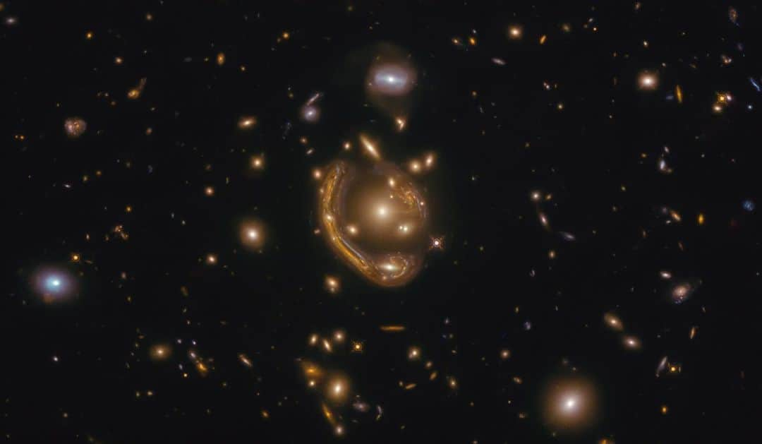 NASAさんのインスタグラム写真 - (NASAInstagram)「This one's for the metalheads.  Although these stars may look like molten metal, they are actually a cosmic optical illusion. The distorted light in this @NASAHubble image is a prime example of gravitational lensing, which occurs when gravity from an object (in this case, a galaxy cluster) bends the light from a background galaxy before the light reaches the observer.  Rock on #HubbleFriday \m/\m/  Credit: @ESA/Hubble & NASA  #space #Hubble #metalhead #universe #galaxies #Einstein」12月19日 3時35分 - nasa