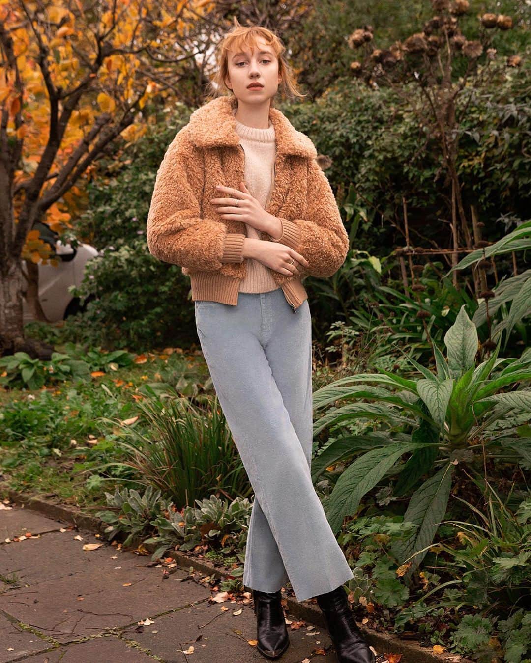 レベッカテイラーのインスタグラム：「Through The Lens: @ashleyjangphoto finds an inspired setting for our Curly Faux Shearling Coat and Braided Pullover.」