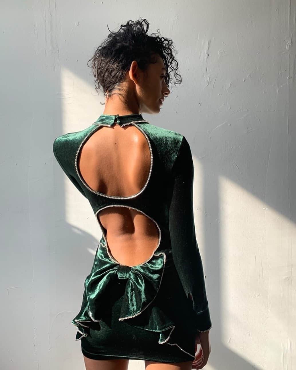 Agent Provocateurさんのインスタグラム写真 - (Agent ProvocateurInstagram)「Whatever your Christmas looks like this year, enjoy it in scandalous style.  Captured in a rich, verdant green, Trudie takes Christmas day dressing to the next level with a high-neckline, playful bow, and circular cut-outs, all designed specifically for your festive frivolities.   Worn by: @amayafaria   #AgentProvocateur #TeaseTheSeason」11月26日 6時15分 - agentprovocateur
