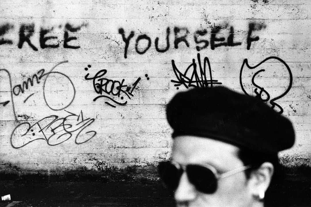 U2さんのインスタグラム写真 - (U2Instagram)「Almost a throwaway shot of Bono with some graffiti but I love this. It has a documentary vibe about it and the message on the wall is very current, and always will be. We were shooting in the rougher parts of San Francisco and tried to incorporate some of the graffiti we encountered. None of the images were used on the album artwork (we simulated a stage moment in a studio for the cover) but some of the single-sleeves were done with these SF shots, notably 'When Love Comes To Town' and 'All I Want Is You’. #AntonU2Takeover @antoncorbijn4real」11月25日 23時00分 - u2