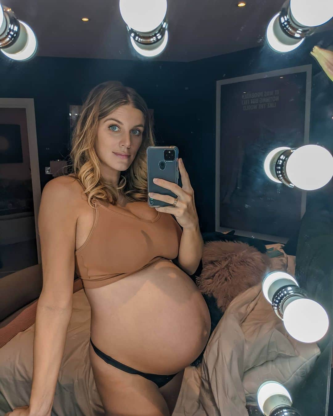 Ashley Jamesさんのインスタグラム写真 - (Ashley JamesInstagram)「The bigger my bump gets the most I'm like... How is this attached to my body? 🤯 I'm coming up to 35 weeks now, and I'm feeling all sorts of different things at the moment... I'm SO excited to meet this little guy and kinda want him to hurry up and come early! But, also it just dawned on me that he could decide to come at ANY time. Like, last night I was SO shattered and was about to go to sleep and I was like, omg imagine if he came then and I wouldn't get a good night's sleep! 😂 Also, the bigger he gets the more I'm like... "Woah, how is he going to get out?" 😂 That said, I cannot wait for the birth! Does that make me weird? I just can't wait to experience it. I'm doing a hypnobirthing course soon too to make sure it's the most positive experience possible! 🧘🏼‍♀️✨🤰🏼 I am still enjoying pregnancy, but equally it feels very much like Groundhog Day now. I suppose lockdown emphasizes that? Like I feel like we've been in lockdown and pregnant for so long the days are just blending together! I can't wait to see friends and family again! (Even though all my family will be in tier 3, so I'm not sure when that can be!)  Although one thing I'll never tire of is his kicking. It's my favourite thing... even when it's right in my ribs! He literally never stops, so he's either going to be a footballer or a ballet dancer. If the kicking tells us how hyper he's going to be outside the womb, then I better get as much rest as possible now. 💤  So on that note, time to put my tracksuit on and watch rubbish TV! Especially after nesting/working like a crazy person all week. What you all watching right now? I need some inspo! ✨ #34weekspregnant #thirdtrimester」11月28日 5時48分 - ashleylouisejames