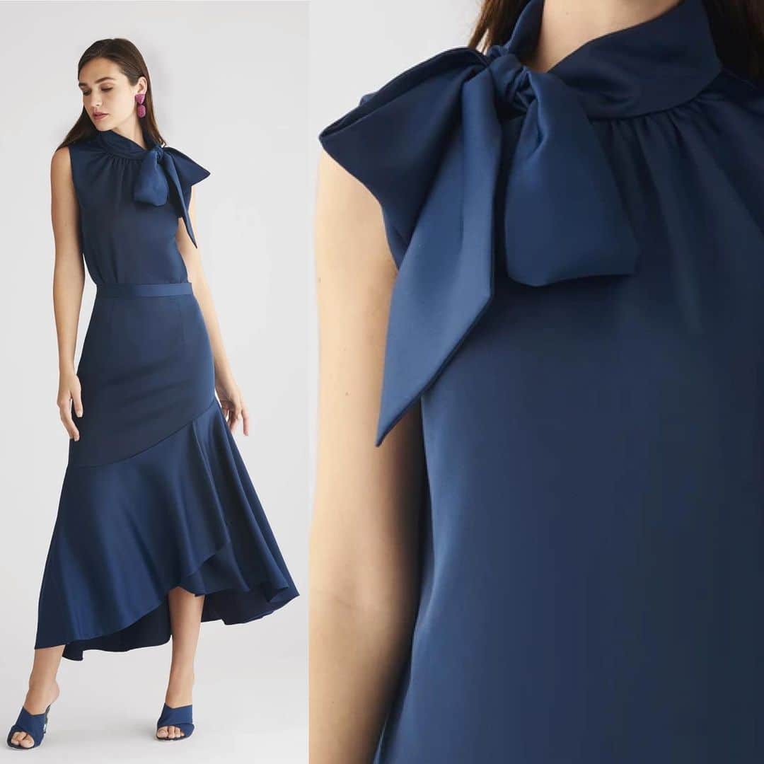 サッチン+バビのインスタグラム：「***SITEWIDE CYBER SALE, USE CODE BF40.*** The Dana blouse featured in a Sandwash Poly Satin is the perfect layering piece or statement blouse. The mock-neck collar is finished at the side with a self-tie bow that can either be arranged at the neck or slung over the shoulder. The Lori skirt paired with the Dana blouse creates the perfect ensemble for day to evening. Featured in a Sandwash Poly Satin, Lori is a beautiful statement skirt on its own. The asymmetric seaming detail falls below the hip to create a shapely line, and the hi-lo hem offers an elevated sense of drama in the silhouette. Easily dressed up or made casually elegant with an oversized knit and boot there are few places this skirt can't go. #sachinandbabi, #celebrate, #classic, #elegant」