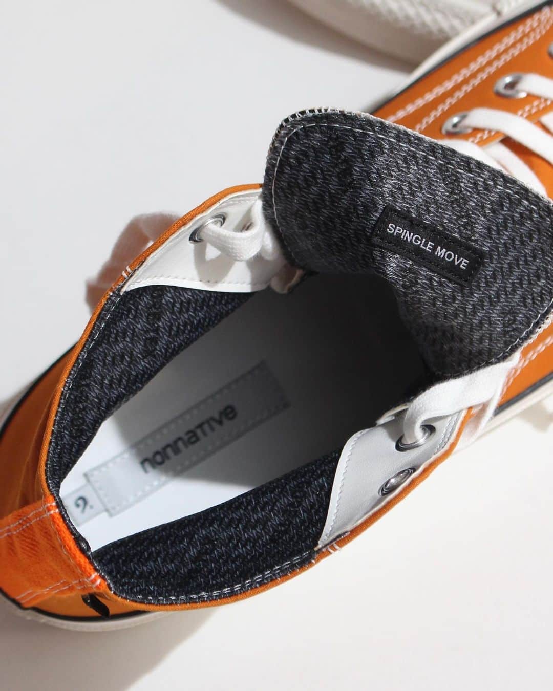 A+Sのインスタグラム：「in stock now  ■nonnative DWELLER TRAINER HI COTTON BC GORE-TEX® 2L COLOR : ORANGE SIZE : 1/26.5㎝, 2/27.0㎝, 3/27.5㎝, 4/28.5㎝ PRICE : ¥35,800 (+TAX)  木型からアッパー、ソールの仕様まで細部にわたりゼロからデザインされ、「スピングルカンパニー」にて制作されたオリジナルスニーカー。高密度織りときめの細かな起毛感が特徴のコットンバフクロスの表地を使用し、ライニングには防水・透湿性に優れたGORE-TEX®を採用。 nonnativeならではの機能性に加え、熟練した職人により丁寧に作られる「バルカナイズ(加硫)製法」を用いることで、耐久性と美しいシルエット、そしてしなやかな履き心地を実現しました。   Original sneakers produced by "Spingle Company", designed from scratch in every detail from the wooden pattern to the specifications of the upper and sole. The outer material of cotton buff cloth, which is characterized by high-density weaving and finely brushed texture, is used, and the lining is GORE-TEX®, which is highly waterproof and breathable. In addition to the functionality unique to nonnative, by using the "vulcanized manufacturing method" carefully made by skilled craftsmen, durability, a beautiful silhouette, and supple comfort have been achieved.  @nonnative  #a_and_s #nonnative #nonnativeDWELLERTRAINERHI  #GORETEX」