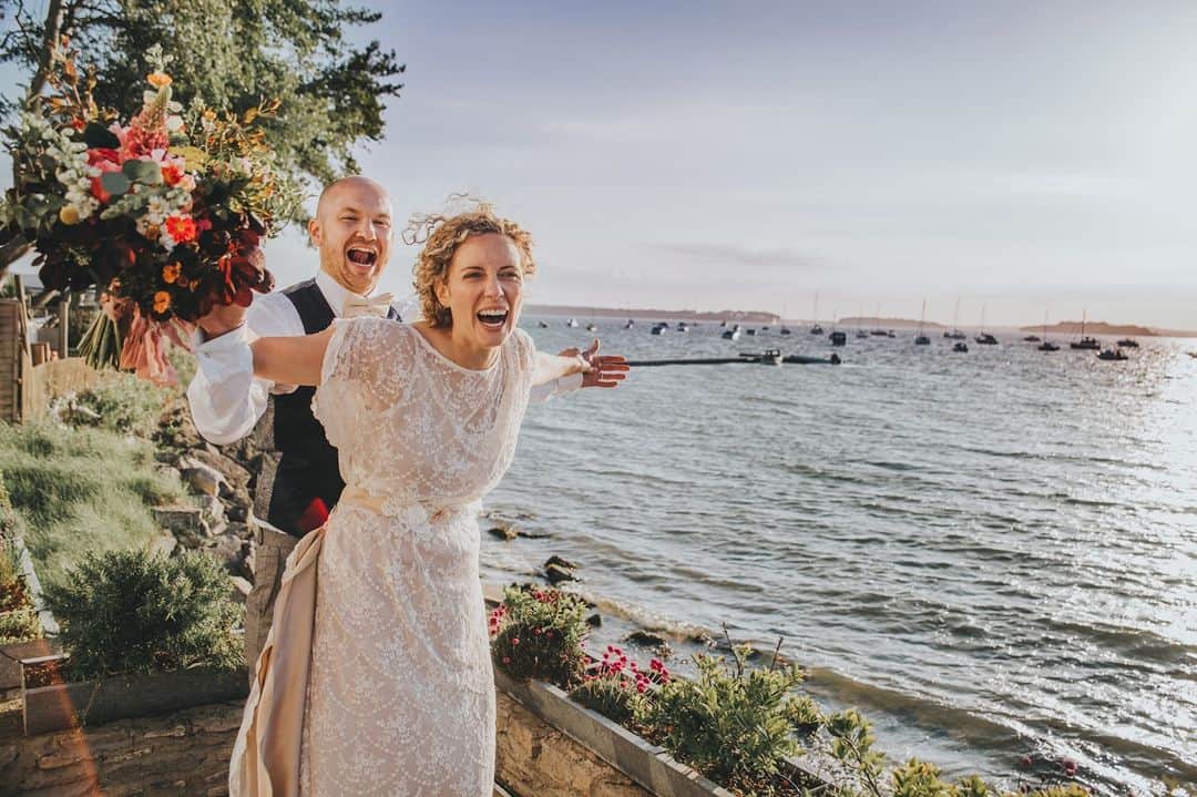 ミナのインスタグラム：「😍 Throwback to Kat and Chad's gorgeous wedding in Dorset a few years back. 😍⁠ ⁠  The amazing Emily from @lotusphotographyuk was Kat and Chad’s photographer. She’s such a cool, caring and supportive person, someone you really want to be there on your wedding day. She once even sewed a bridesmaid into her dress when the zip broke! Emily and I connected after Kat’s wedding and she visited my showroom and took a few beautiful photos while she was there. Have someone super talented to immortalise your big day! Check out Emily’s website, link in bio. ⁠ ⁠ ⁠ ⁠」