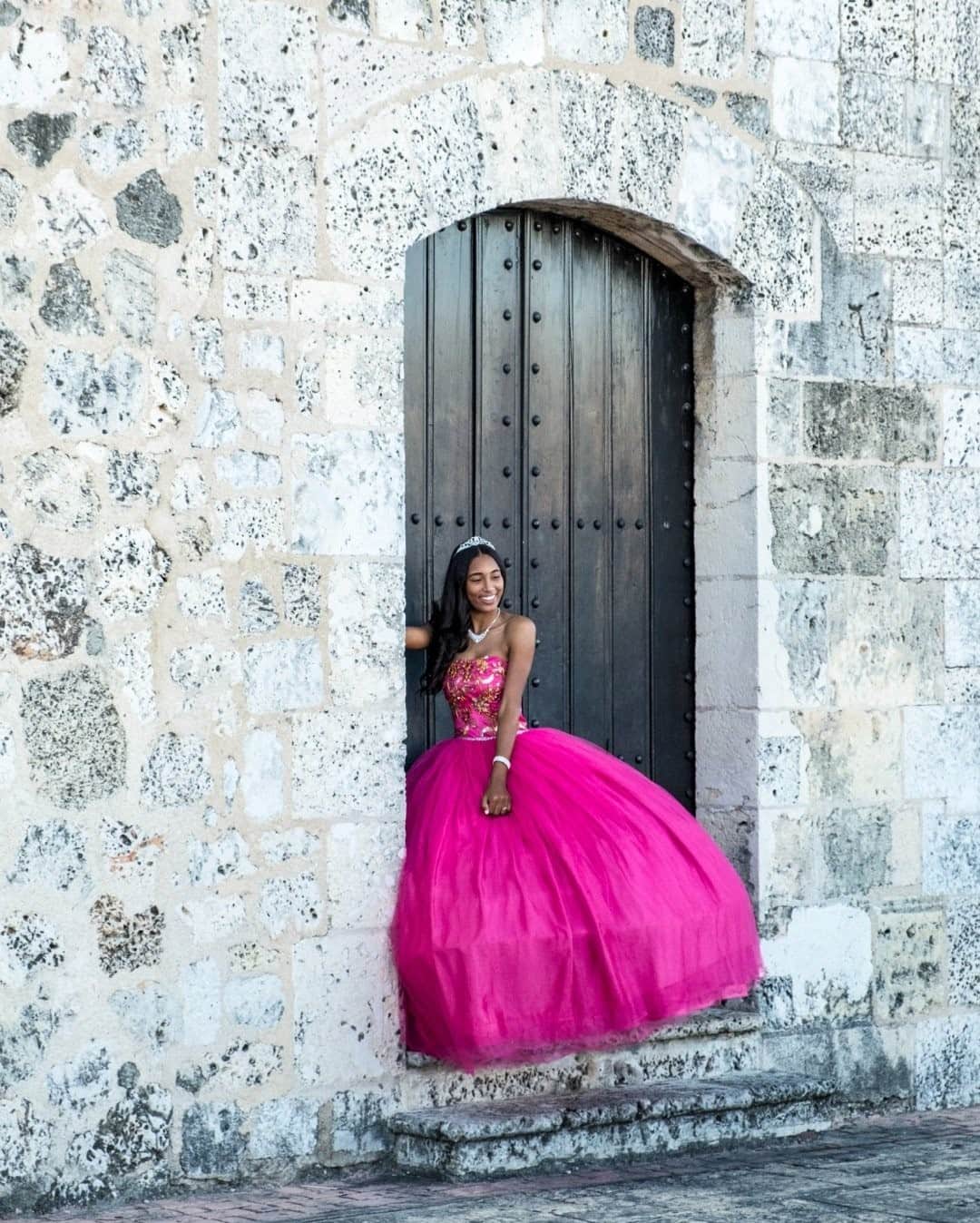 National Geographic Travelさんのインスタグラム写真 - (National Geographic TravelInstagram)「Photo by @francescolastrucci / A quinceañera—a girl celebrating her 15th birthday—poses for a portrait by the Museum of Royal Houses in the colonial center of Santo Domingo, the capital of the Dominican Republic. The word quinceañera is also used for the very special and festive event marking the transition from girlhood to womanhood. The celebration is an important milestone in a girl’s life. The quinceañera emphasizes the importance of family and society in the life of a young woman.  Follow me @francescolastrucci for more places, daily life, and stories around the world. #republicadominicana #santodomingo #dailylife #portraitphotography」11月30日 0時37分 - natgeotravel