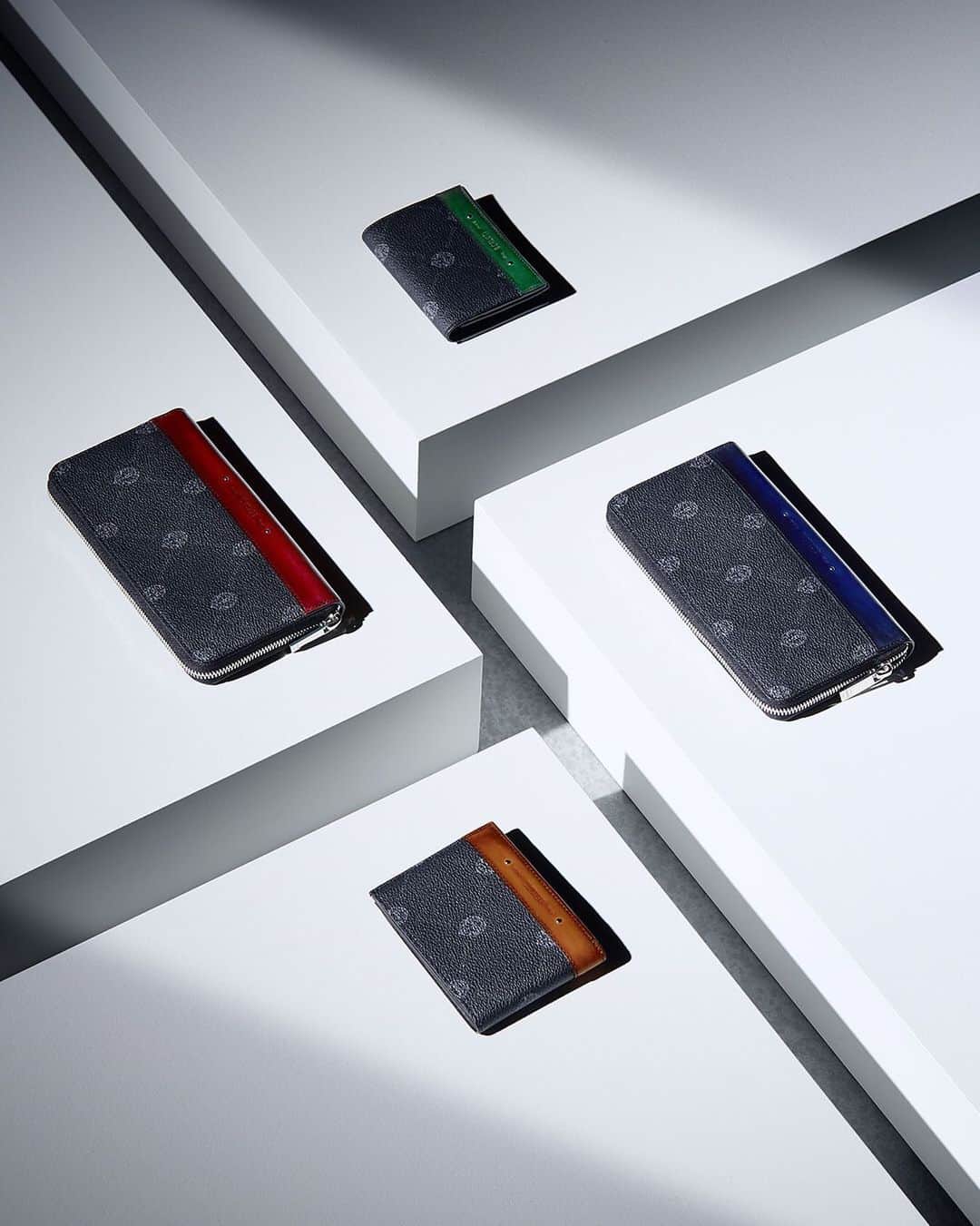 ベルルッティのインスタグラム：「- THE #BERLUTI VIBRANT HOLIDAYS BY @kris_van_assche -    This year, Berluti celebrates the end-of-year holidays with the new Home & Office Objects Collection and a selection of emblematics including the new SIGNATURE canvas collection with a colourful patina twist.   For the new Home & Office Objects Collection, Berluti has teamed up with a select group of highly respected European makers, including Werkstätte Carl Auböck, Bottega Ghianda, San Lorenzo Silversmiths and Simon Hasan, commissioning Berluti editions of iconic historic designs by Gae Aulenti, Afra and Tobia Scarpa, Carl Auböck II and III and new work by Simon Hasan, dating from every decade between the 1950’s and 2000’s.   Both functional and statement-worthy, the selection of emblematics highlights the Un Jour Gulliver, the Toujours tote bag, and the new SIGNATURE canvas collection which includes the Séjour card holder, the Explorer backpack and the Nino clutch to name a few.   For the occasion, the Venezia leather takes on a bold, joyful twist with an array of new patinas. Originally created last year especially to restore the upholstery of Pierre Jeanneret’s furniture pieces- and inspired by the rich colours found in the architecture, landscape and foliage of the north Indian city of Chandigarh -, these vibrant new colours include Utopia blue, Acqua blue, Nespola orange, Sunset purple, Rose Garden pink, Simal red and Grass green. Hand-applied to the Venezia leather and Venezia leather details of the SIGNATURE canvas accessories, they enhance every piece with a unique depth of colour.   Available In-Store and on the E-Shop.   Our Stores in France are now open and our teams will be delighted to welcome you.」