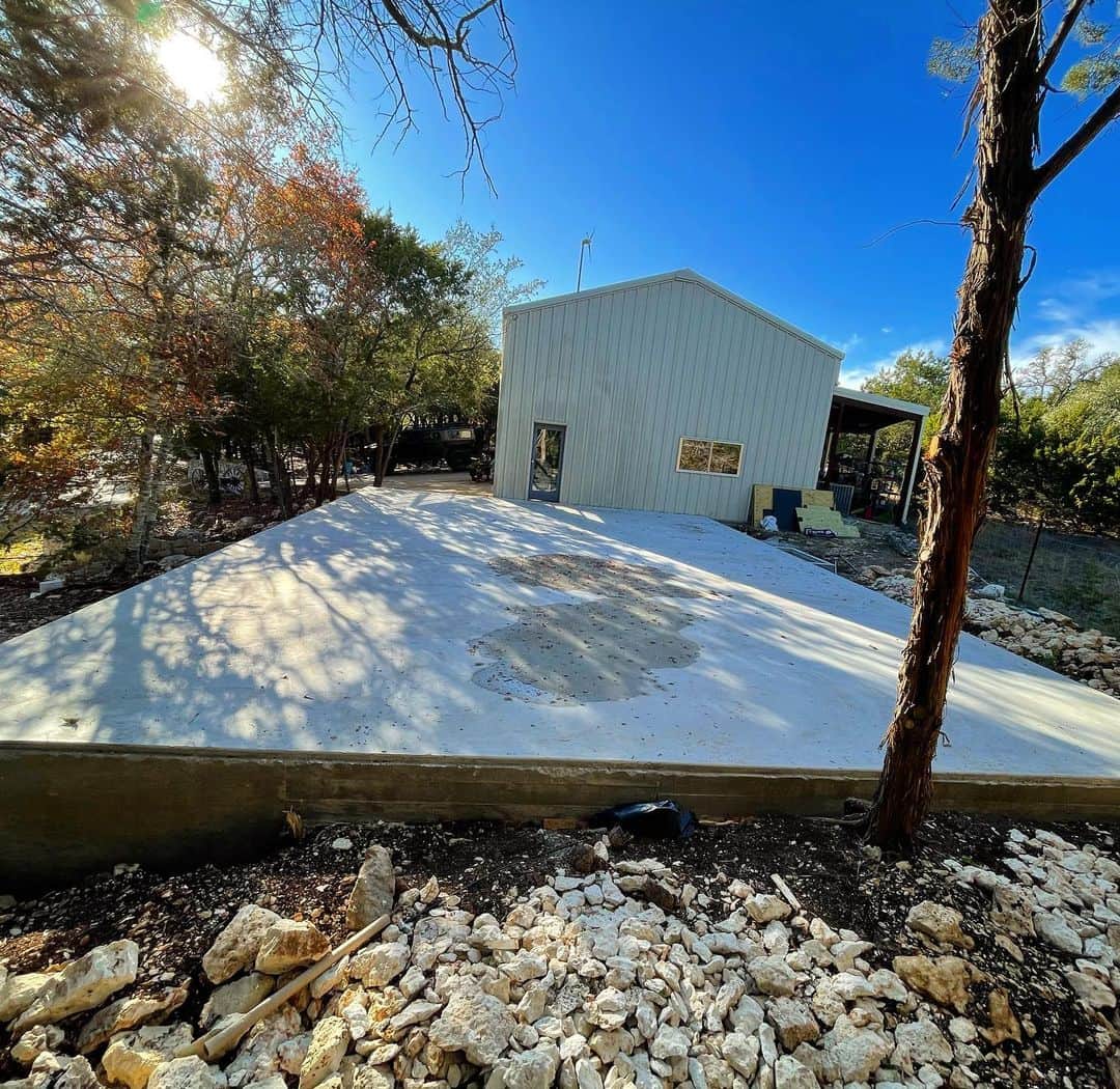 ウエストコーストチョッパーズのインスタグラム：「......... We got the slab all done last week for my personal shop extension.  I’m looking for somebody in central Texas that does pre-cast concrete walls. This will make it a little more quiet and insulted and leave all the noisy machines in the existing building.  I was thinking 3 walls pre-cast concrete. And the outward facing wall structural steel. With a bunch of vintage factory windows I have. Is that possible?  Who wants to do some trading?  I have some badass guns!  👇🏾👇🏾Halla at ya Boy👇🏾👇🏾  guns@jessejames.com  Or DM me😎  Thanks #jessejames」