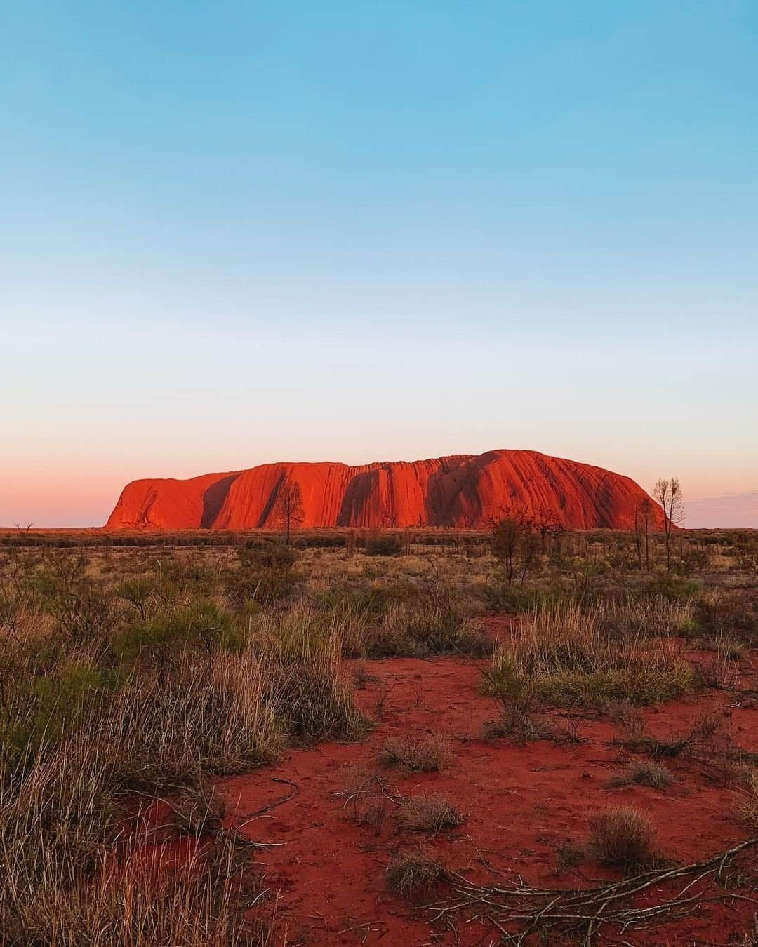 Australiaさんのインスタグラム写真 - (AustraliaInstagram)「Sharing a little @seeuluru magic with you today ❤️ There's something about the rusty red landscape of @visitcentralaus that makes us yearn for an outback adventure, and this stunning shot captured by @alexxsadventures has got us daydreaming of a visit to @ntaustralia! There's plenty of ways to soak up this iconic part of the #RedCentreNT, from a scenic walk around the base of #Uluru with a local guide to dinner under the stars with @exploreuluru's #TaliWiru experience 🥂 However you choose to enjoy it, we guarantee it's going to be a seriously memorable holiday. If you’re looking for even more reasons to put #Uluru on your bucket list, head to the link in our bio. #seeaustralia #ntaustralia #northernterritory #holidayherethisyear」12月2日 19時00分 - australia