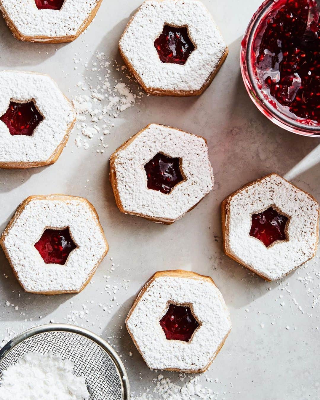 Gaby Dalkinさんのインスタグラム写真 - (Gaby DalkinInstagram)「Guess who’s back with another epic recipe today… my Omi!!! This time we’re making her famous Linzer Christmas Cookies with copious amounts of @bonnemaman_us Raspberry Preserves because OMG THAT STUFF IS WHAT MY DREAMS ARE MADE OF!! Omi used to make these for us every Christmas when we were kids and they are truly perfection! I cannot WAIT until next year when she can make them for me again in real life!! Recipe is below and it’s the perfect way to spend some time in your kitchen this week/weekend. ALSO - bonus, you can re-use / up-cycle the Bonne Maman glass jar and fill it up to gift to your friends and fam. But also I 100% won’t judge you if you keep the cookies for yourselves. FYI - legit any other flavor of Bonne Maman is brilliant in this recipe. I basically tested them all. DON’T JUDGE ME. It’s a tough job but someone’s gotta do it!  3 cups flour 3/4 cup sugar 1 1/2 cups butter (softened) 2 tablespoons water 1/4 teaspoon salt 1 teaspoon vanilla extract 3/4 cup Bonne Maman Raspberry Preserves (or any other of your fav Bonne Maman preserves) Powdered sugar for dusting   Cream together the butter, sugar and vanilla until just combined in a stand mixer.   Add the flour, water and salt and mix on low speed until the dough comes together in a cohesive mass. Turn the dough out onto your work surface and shape into a flat disk. Wrap with plastic wrap and place in the fridge for at least 30 minutes.   Roll the dough out to a uniform 1/4- inch thickness and, using a cookie cutter, cut rounds. Using a smaller cookie cutter, make holes in the middle of half of your rounds.   Place cookies on a parchment lined baking sheet and chill for an additional 15 minutes prior to baking. Preheat the oven to 350 degrees.   Bake the cookies for 20 - 25 minutes, until the edges begin to brown. Once cooked, remove from the oven and allow the cookies to cool to room temperature on a cooling rack.   Dust the cut out cookies with powdered sugar and spread the Bonne Maman Raspberry Preserves on each solid cookie, about 1/2 - 1 tablespoons each. Sandwich your cookies together and serve, or gift to loved ones in an upcycled Bonne Maman jar for the perfect holiday gift 🎁」12月4日 4時49分 - whatsgabycookin