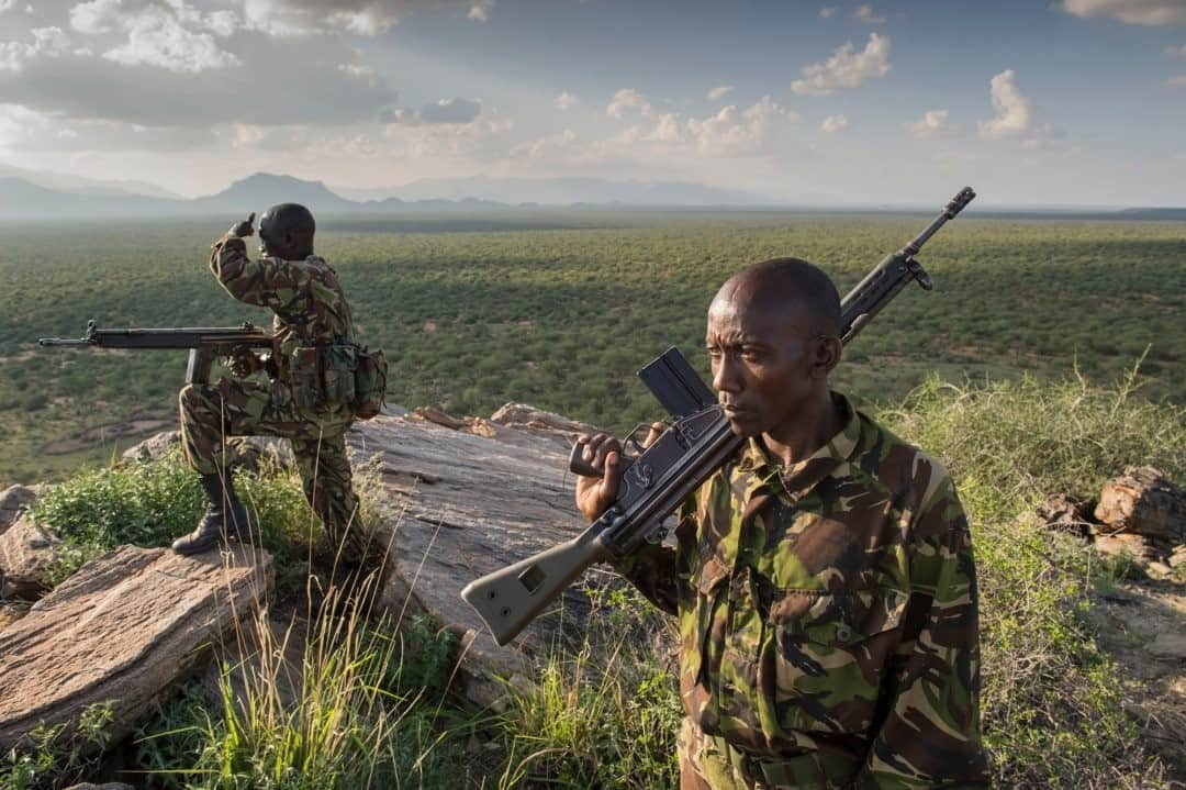 ナショナルジオグラフィックさんのインスタグラム写真 - (ナショナルジオグラフィックInstagram)「Photo by @amivitale / A mobile scout team with Northern Rangelands Trust (@nrt_kenya) patrols for poachers in northern Kenya. The patrols look and act like an infantry unit; dog handlers use bloodhounds to track poachers. "It's a war we are fighting," Sergeant Kariuki said. "And information is everything."  With the pandemic, their work has become more critical, just as funding has become more elusive—tourism has vanished. The threat to their livelihoods and to nature grows ever greater. All over Africa, conservationists have reported an increase in illegal bushmeat hunting, and they fear organized poaching of rhino horn and ivory could be next. Learn more, including how to help, by following @amivitale and @nrt_kenya.  @thephotosociety @photography.for.good #kenya #conservation #rhinos #africa」12月4日 8時35分 - natgeo