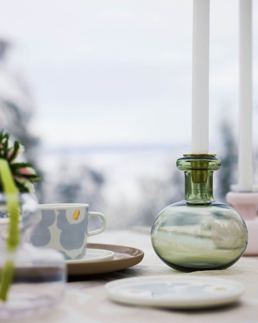 マリメッコのインスタグラム：「"For me, it was very important that the new candleholder had a clear relationship with the Urna, Ming, and Flower vases. When put together, I wanted this family to form a pattern of some sort. These new candle holders actually draw inspiration from a very simple idea: a wine bottle with a candle on it." - Designer Carina Seth Andersson. #marimekko」
