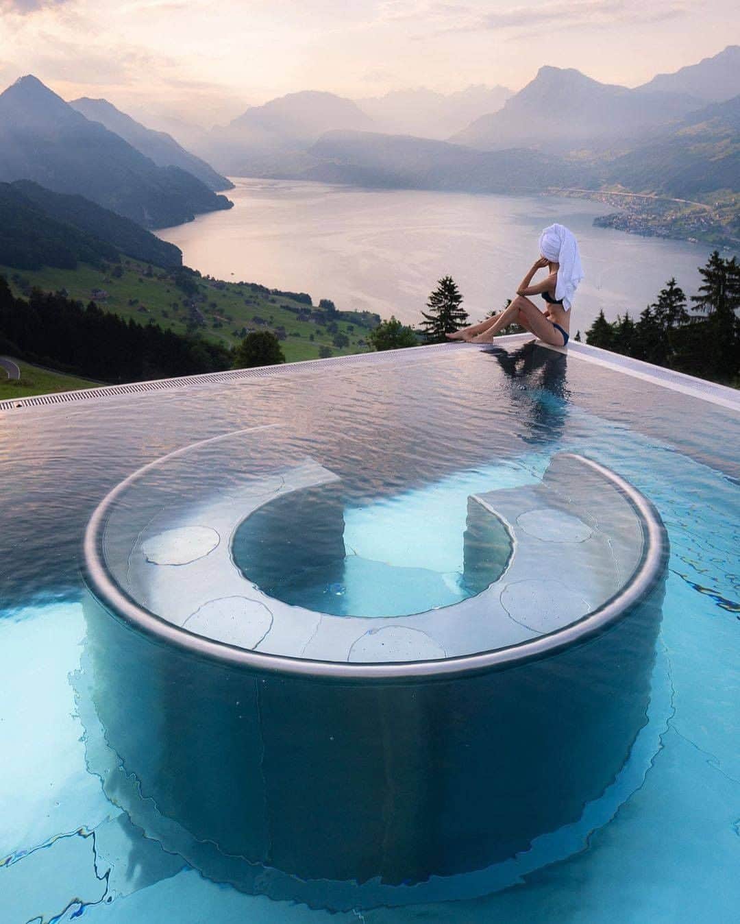 Discover Earthさんのインスタグラム写真 - (Discover EarthInstagram)「This is an amazing view, right ? Villa Honegg offers unparalleled views and is one of the Swiss hotels you have to see to believe. From its heated pool you can take in the sight of Lake Lucerne glistening as the sun goes down, just by the foot of the Alps. The hotel itself has been open since 1905 and has since been given a modern makeover to bring into the 21st Century. This hotel has been named a “hideaway hotel” for its blend of comfort and the great visitor experience that it offers. There’s perhaps no better way to take in Central Switzerland.  #discoverswitzerland🇨🇭 with @jess.wandering   . . . . .  #switzerland  #schweiz  #swiss  #suisse  #switzerlandwonderland  #visitswitzerland  #myswitzerland  #inlovewithswitzerland  #ig_switzerland  #switzerland_vacations  #zurich  #swissalps  #amazingswitzerland  #switzerlandpictures  #igersswitzerland  #geneva  #svizzera  #exploreswitzerland  #bern  #igerssuisse  #ig_swiss  #iloveswitzerland  #alps  #blickheimat  #super_switzerland  #basel  #valais  #wu_switzerland  #luzern」12月5日 2時00分 - discoverearth