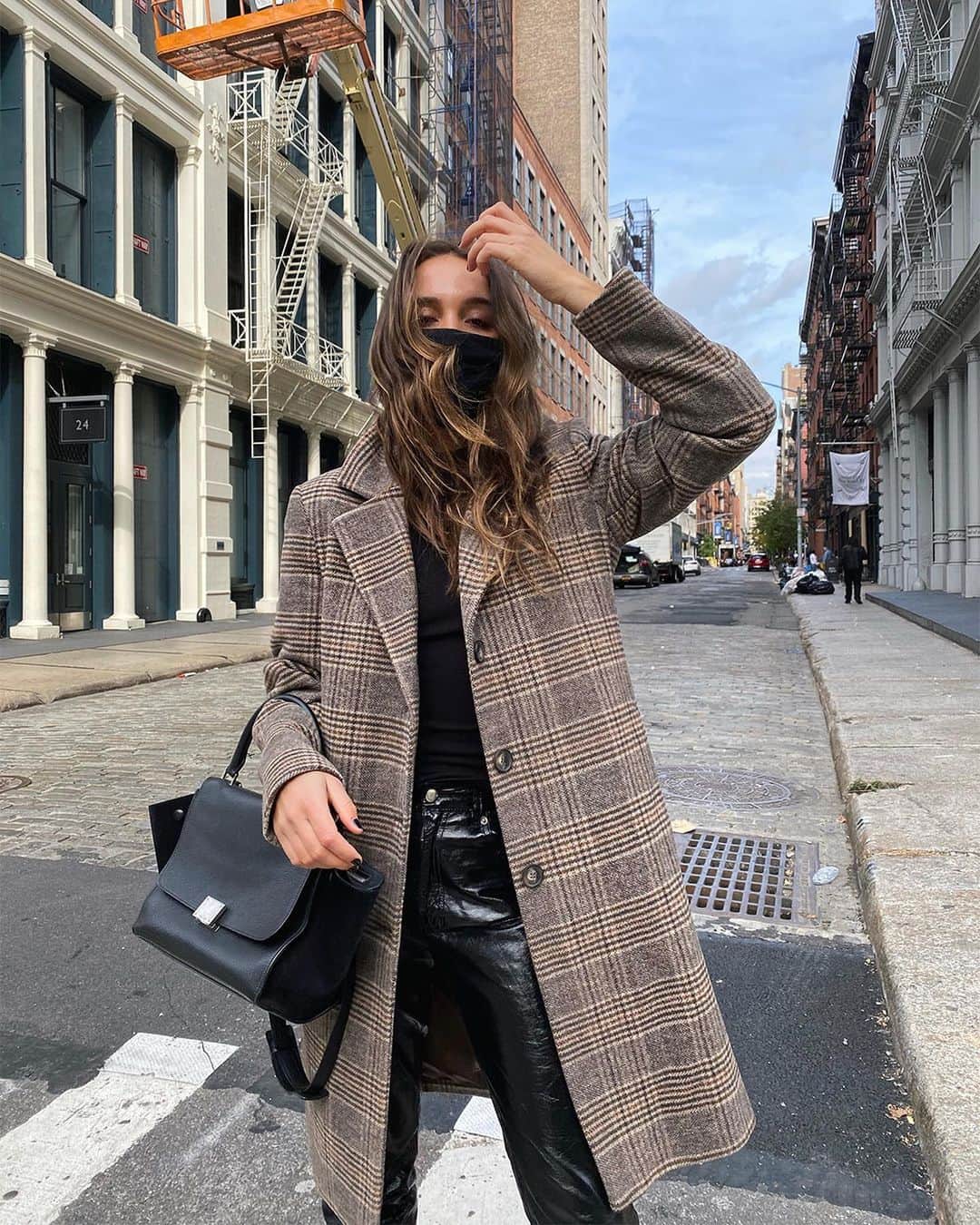 DKNYのインスタグラム：「@LilyMontasser wears the #DKNY Plaid Car Coat on the streets of New York. #DKNYSTATEOFMIND」
