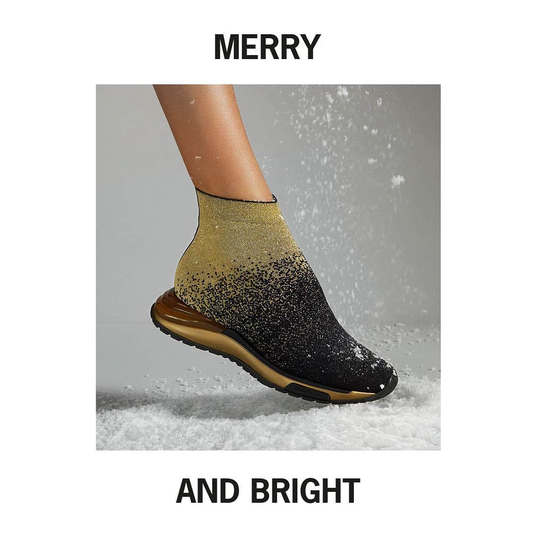 サルヴァトーレ・フェラガモのインスタグラム：「Step into a dazzling festive season with star-speckled favourites from the #FerragamoHoliday collection. Ultra-glam sock sneakers and a gilded Vara ornament sandal to pave the way into a holly jolly season. #UnwrappingJoy」
