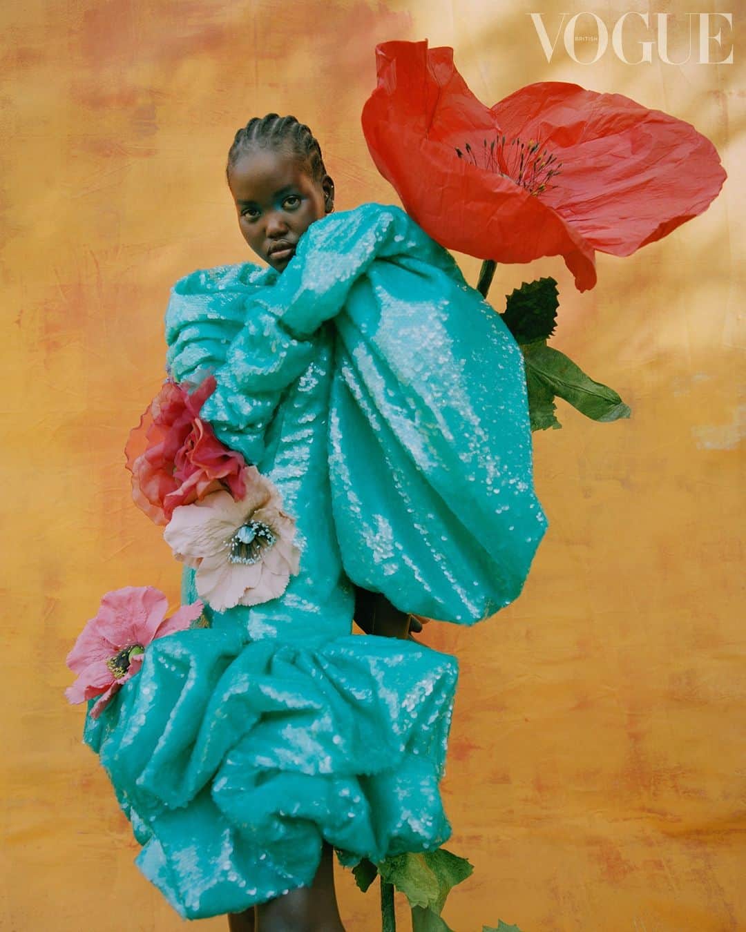 British Vogueさんのインスタグラム写真 - (British VogueInstagram)「The only way to overshadow a towering poppy? Try some shimmering turquoise sequins on for size. In the January issue of #BritishVogue @NadineIjewere brings the resort collections to life in a dream-like story that will lift spirits and inspire a new year full of blooming colour. See the full story in the new issue, on newsstands and available for digital download now. Click the link in bio to get yours.  #AdutAkech wears a @Balmain dress and corsages from @VVRouleaux, photographed by @NadineIjewere and styled by @PoppyKain, with hair by @Sophie_Jane_Anderson, make-up by @AmmyDrammeh, nails by Zaida Igani and set design by @Sean_Thomson_.」12月5日 19時10分 - britishvogue
