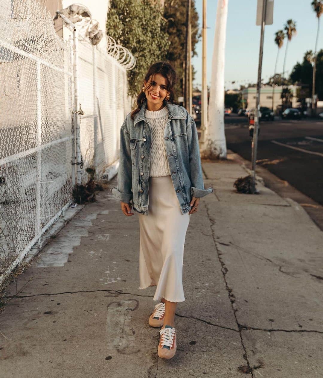 Collage Vintageのインスタグラム：「Casual Saturday wearing oversized denim jacket from @glimstudios paired with ivory knit, silk skirt and colorful sneakers. 🌸」
