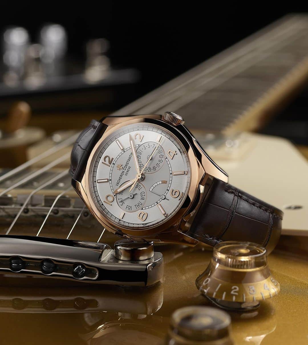 のインスタグラム：「⁣In tune. 🎸🎶⠀⠀⠀ ⠀⠀⠀ The Fiftysix Day-Date will accompany the modern connoisseur in his every move. ⠀⠀⠀ ⠀⠀⠀ The date at 3 o’clock, the power-reserve indicator at 6 o’clock and the day of the week appearing at 9 o’clock. ⠀⠀⠀ All powered by a self-winding movement, the Calibre 2475 SC/2.⠀⠀ ⠀ ⠀ ⁣#VacheronConstantin #OneOfNotMany #vacheron #thehourlounge #watches #watch #watchesofinstagram #horology #watchoftheday #instawatch #geneva #swissmade #swisswatch #watchesofinstagram #luxury #luxurywatch #fiftysix⠀ ⠀」