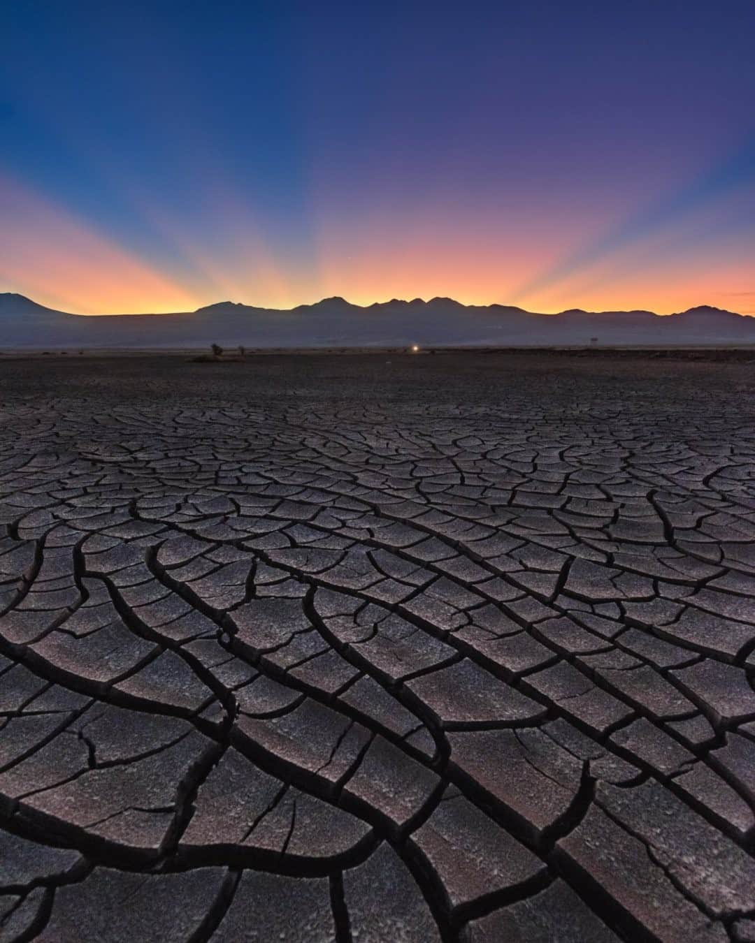 National Geographic Travelさんのインスタグラム写真 - (National Geographic TravelInstagram)「Photo by @babaktafreshi / Sunrise approaches the dry vastness of the Atacama Desert with strong crepuscular rays above the Andes on the border of Chile and Bolivia. Also called God rays, these sunbeams in both morning and evening twilight originate when the sun is just below the horizon and the rays reach us through openings in clouds, a mountain range, or other obstacles. Explore more of Earth and sky photography with me @babaktafreshi. #atacama #earth #sunrise」12月7日 8時35分 - natgeotravel