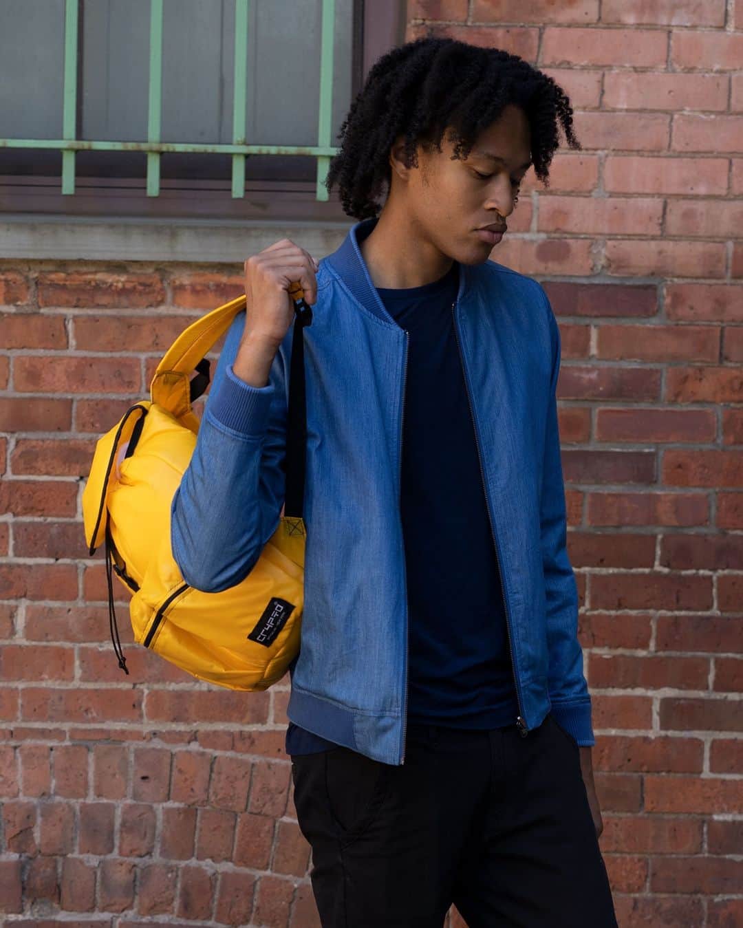 ブルックリンインダストリーズのインスタグラム：「Brandon in the Huron Reversible Bomber Jacket, and Crypto WA21 Backpack. #brooklynindustries #liveworkcreate  25% OFF WINTER SALE CONTINUES ❄ Use code WINTERSALE to save on all sweaters and jackets.」