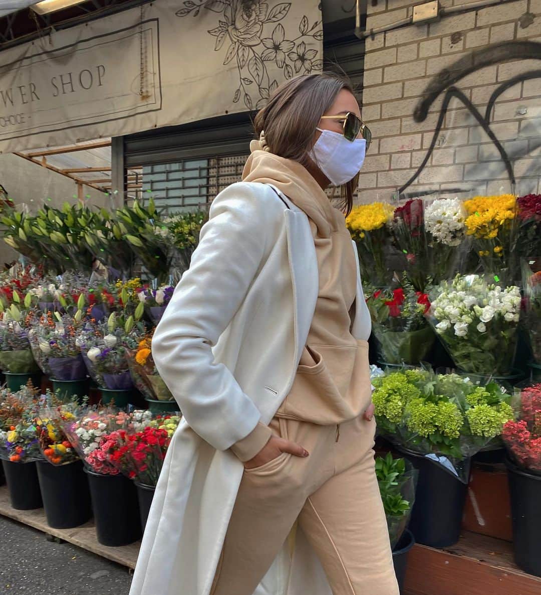 We Wore Whatのインスタグラム：「Next two stops on my neighborhood small business tour: Prince Flower Shop & Archive Cleaners [errands in my new @shopweworewhat sweatpant sets in beige and hay] ⁣ ⁣ Prince Flower Shop is one of the most charming little places to stop by on a Saturday morning walk in Soho with the loveliest owner. The beautiful selection of fresh flowers and plants line the street corner of Prince St. just East of 6th avenue. Beyond the charm, the quality and reasonable prices keep us coming back!⁣ ⁣ Archive Cleaners • This launder has been my downtown go-to for over 6 years! They offer pickup and delivery for both dry cleaning and wash and fold services. Manny, the owner pays close attention to details and remembers everyone’s names and addresses (even their dogs too)! The affordable prices and reliable service make this place a long-time customer favorite.」