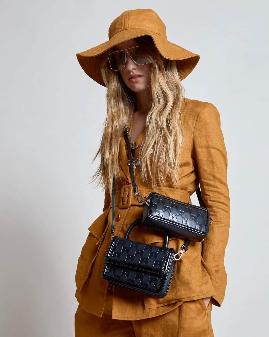 カレンウォーカーのインスタグラム：「Our new crossbodies feature the Karen Walker monogram for the first time, embossed on Napa leather.」